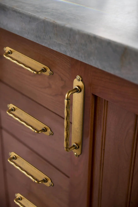 Five Inch Antique Brass Cabinet Pull Handles With Timeless Oval Backplates, Hella Durable Zinc Alloy Drawer Knobs For Kitchen Cabinets And Dressers, Rust Proof Two Pack Slick Smooth Handle Grip on wooden drawers.