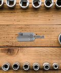 Hex Shank Slotted Wing Nut Socket Wrench For Hurricane Shutters And Panel Nuts A Sweet Upgrade on a wooden surface with sockets.