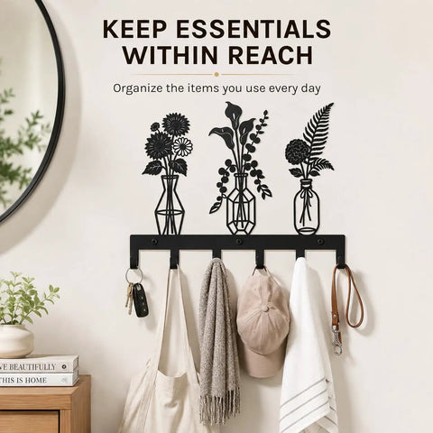 Knockout Premium Decorative Floral Metal Wall Coat Rack Featuring Six Heavy Duty Hooks And Matte Black Finish for keys and hats hanging.