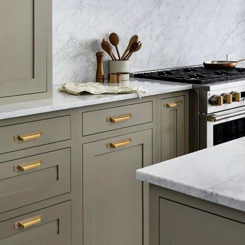 Heavy Duty 10 Pack Of Three Inch Antique Brass Cabinet Pulls With Slick Zinc Alloy Build And Tight Screw Placement For Kitchen Drawers in a modern kitchen.