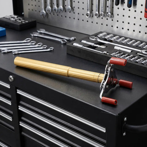Ladder Free Smoke Detector Remover Tool Aluminum Alloy Transducer Gripper on workbench with tools, designed for safe ceiling sensor swaps.