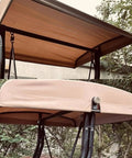 Heavy Duty Outdoor Swing Canopy Replacement Cover For 3 Seater Porch Swing All Weather Waterproof Khaki Top Shade Universal Fit Fabric Canopy For Patio Garden Backyard And Furniture Awning Size 198x125cm shown installed on a swing frame in a garden.