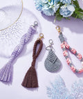 8 Set DIY Macrame Wristlet Keychain Kit For Adults Colorful macrame cord keychains laid out on a flat surface with tassels and clasp details.