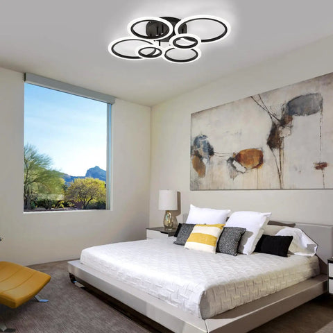 Sleek Modern LED Flush Mount Ceiling Light With Six Black Rings, Low Key Low Profile Ceiling Fixture in a bedroom setting.