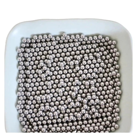 Premium 316 Stainless Steel Bearing Balls Precision Ground For Heavy Machinery in a white bowl, showing multiple sizes.