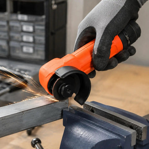 Close-up of Workhorse Heavy Duty Handheld Angle Grinder cutting steel with sparks flying, ideal for tight corners.