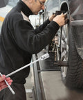 T Handle Socket Wrench Set with Serious Grip for Lug Nuts and Auto Repairs in use during vehicle maintenance.