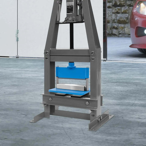 Heavy Duty Press Brake Attachment For 12 And 20 Ton Hydraulic Shop Presses, shown installed in a garage setting.