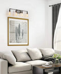 Living room with Dope Industrial Water Pipe Vanity Light 4 Head Wall Lamp Dark Silver Finish above framed photo and beige sofa.