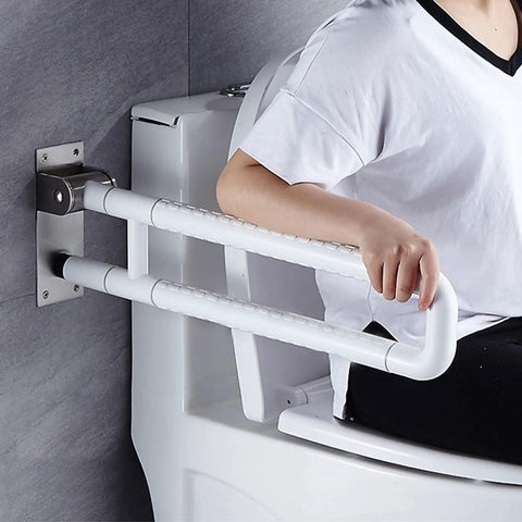 Built Tough Twenty Eight Inch Flip Up Toilet Grab Bar With Rock Solid Stainless Core And No Slip Abs Handle For Wall Mount Bathroom Setup Easy Secure Install For Seniors Or Post Surgery Recovery White, in use beside toilet.