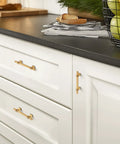 Heavy Duty Gold Cabinet Pulls And Drawer Handles Offering A Slick Upgrade For Kitchens And Baths Durable Stainless Steel And Zinc Alloy Base Plus Four Inch Center Spacing Anti Tarnish Coating Makes This Five Pack A Top Shelf Home Renovation Essential on white cabinets.