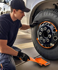 Man using Heavy Duty Adjustable Tire Dolly For Slick Wheel Rolling And Quick Lug Alignment With Steel Base on car wheel.