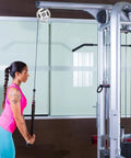 Woman using Heavy Duty Replaceable Cable Pulley Wheels 10 Pack Smooth As Butter Aluminum Alloy Lifting Blocks in gym.