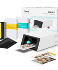 All In One Color Sticker Printer And Cutter For DIY Crafters And Custom Labels And Gifts With Thermal Dye Sublimation 300 DPI And Precise AI Auto Cutting For Home Or Studio Use, showing printer with paper and accessories.
