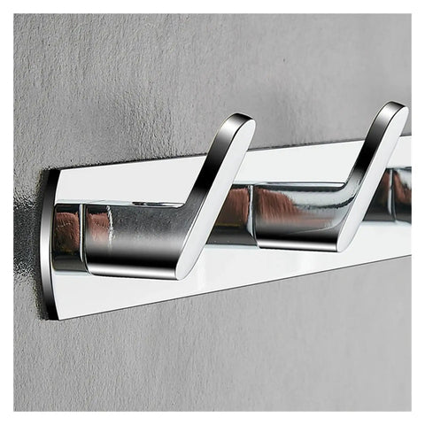 Heavy Duty Chrome Wall Hook Handles Daily Hustle In Bathrooms And Kitchens While Snagging Towels Keys And Coats To Stay Put On Tile Or Drywall Locks Down Solid With Zero Rust After Quick Install, displaying three sturdy hooks on a gray wall.