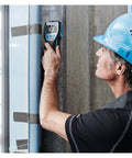 Man using Heavy Duty Stud Finder Wall Scanner With Slick Visual Center Marker to detect hidden pipes and cables.
