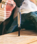 Close-up of One Inch Wood Screws 130 Piece Set Self Tapping Flat Head Phillips Black Carbon Steel For Indoor Furniture