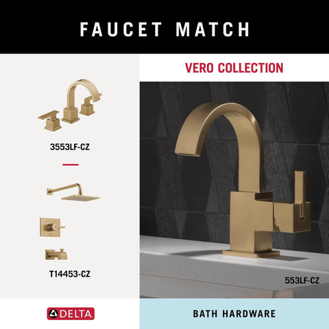 Champagne bronze faucet and fixture set on gray counter from Vero Collection, highlighting modern bath hardware design.