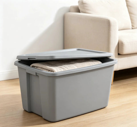 Kickass 30 Gallon Heavy Duty Plastic Storage Bin With Secure Snap Lid For Garage Organization Seasonal Gear Sorting And Everyday Essentials In Matte Gray Finish with towels inside.