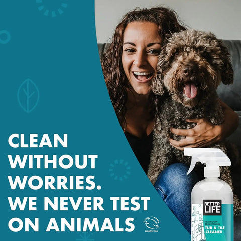 Woman smiling with dog next to cruelty-free label and Tea Tree Bathroom Cleaner Spray For Glass And Tile, 32oz bottle displayed.