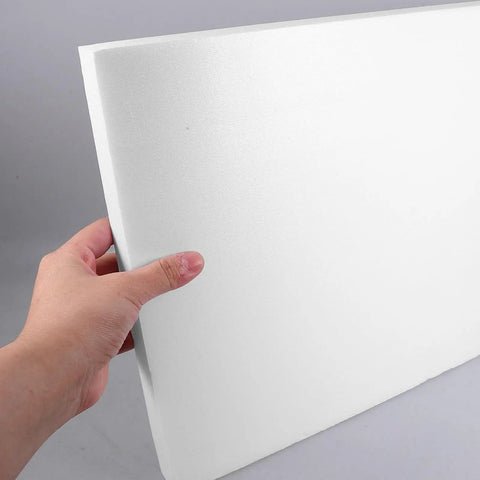 Hand holding a white Two Piece High Density Polyurethane Foam Sheet Hard As Nails Cuttable Cushioning Pad for packaging.
