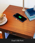 Madison Side Table With Built In Lamp, Wireless Charging Pad And USB Port beside books and coffee cup
