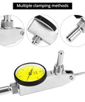 Amazon dial test indicator with yellow dial, silver body and steel dovetail clamps; front view