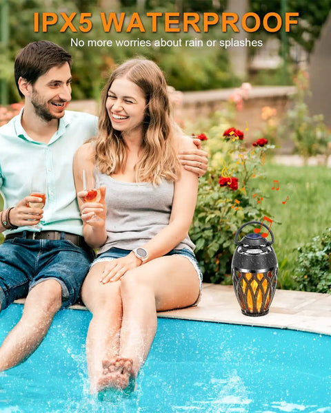Twin Pack Outdoor Bluetooth Flame Speaker With LED Torch Dope Ambience Light by a poolside, IPX5 waterproof, garden use