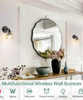 Living room with two vintage battery operated wall sconce with amber tulip glass lampshades mounted on white wall near mirror.