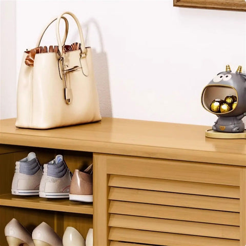 Spacious Six Tier Freestanding Shoe Cabinet Boasting Four Doors And A Nifty Drawer To Stow Away Your Best Kickers In Style placed beside a stylish handbag and decorative figurine.