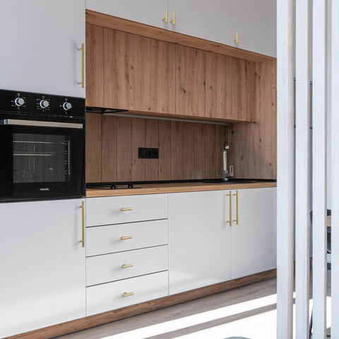 Top Shelf Six Pack Solid Brass T Bar Cabinet Pulls Hella Durable Gold Hardware For Kitchens And Dressers Clean Hammered Polish With Five Inch Center Spacing on white kitchen cabinets.