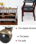 Heavy Duty Two Inch Swivel Caster Wheels For Vintage Furniture With Slick Brass Rolling Base And Rock Solid Locking Brake showcased under a vintage-style chair.
