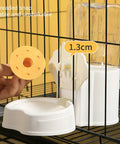 Automatic Pet Water Dispenser And Food Feeder With Leakproof Cage Mount showing orange threaded snap and clear water bottle.