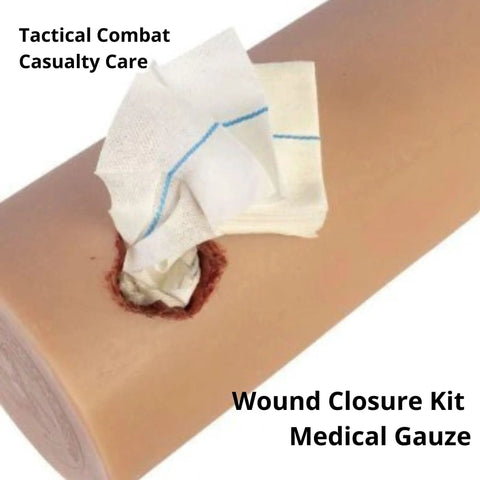 First Aid Quick Clot Combat Gauze 3in x 12.5in white hemostatic gauze on simulated arm wound (close-up)