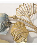 Close-up of Modern Wall Mounted Coat Rack Featuring Five Sturdy Metal Hooks, showcasing detailed metal leaves and gold accents.