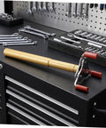 Heavy Duty Ceiling Detector Removal Tool With Badass Rubberized Claw And Extendable Aluminum Shaft resting on a tool chest.