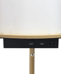 Close-up of USB ports and outlet on 62.5 Inch Round Modern Shelf Etagere Floor Lamp With USB Ports And Outlet Linen Shade
