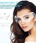 Real Deal 6 Pack Clear Lab Safety Glasses Featuring Ventilated Side Shields And Lightweight Wraparound Design For Shop Splashes And Daily Eye Protection Making Work A Breeze worn by a woman with long dark hair.