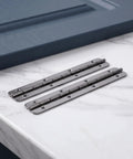 2 Piece Heavy Duty Stainless Steel Piano Hinge 5 Inch Black mounted on a marble surface for cabinet door hardware use.