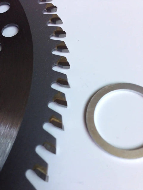 Close-up view of Three Pack Carbide Tipped String Trimmer Blades Eight Inch Wood Limb Cutting Teeth sharp cutting edges and circular washer.
