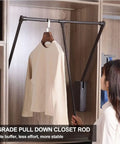 Retractable Pull Down Closet Rod For Hanging Clothes With Smooth Two Way Hydraulic Damping Adjustable Wardrobe Hanger shown in use