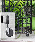 Spring Loaded Gate Rollers Heavy Duty Yard Fence Support Zero Drag Four Inch Black Driveway Casters Quick Install For Residential And Ranch Gates mounted on a decorative gate