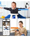 Dual Lens Indoor Wireless Security Camera Featuring Straight Up Crystal Clear Video And Kickass 360 Pan Tilt With Full Color Night Vision Smooth Dual Band WiFi Streaming And Legit Motion Tracking Alerts For Solid Home Protection in a living room setting with a child and parent.
