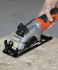 Heavy Duty Mini Circular Saw With Beefy 4 Amp Motor And Crisp Laser Sight For Dang Clean Cuts On PVC Laminate Drywall And 2x4s Featuring Slick Dust Collection Port on a wooden surface.
