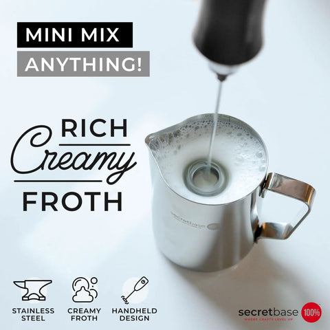 Handheld USB C Rechargeable Milk Frother With 3 Speed Settings and Stainless Steel Double Whisk creating froth in metal pitcher