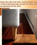 Adjustable Wood Couch Wall Spacers 2 Pack Shield Your Drywall From Rough Bumps Solid Brown Furniture Gap Blocks preventing wall damage while providing outlet access.