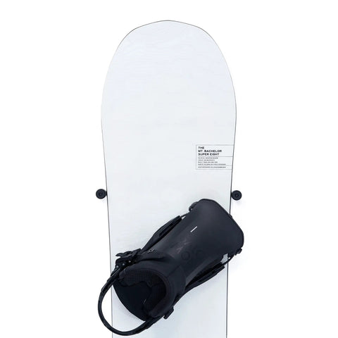 Fresh Snowboard Wall Mount Storage Rack With Edge Safe Grip Pads For Vertical Board Display and Clean Floating Shelf Design that holds a snowboard with a black boot.