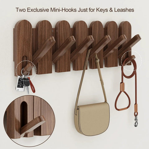 Walnut Wood Coat Rack Wall Mount With Eight Retractable Hangers And Two Dedicated Key Hooks displaying keys and a leash