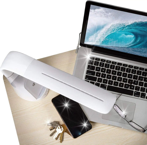 Purify LED Desk Lamp With Wireless Charging, Touch Activated, Flexible Gooseneck on a desk with laptop and phone