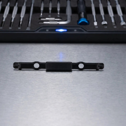Rock Solid Luggage Pull Handle Replacement Button For Telescopic Suitcases on metallic surface with tool kit in background.